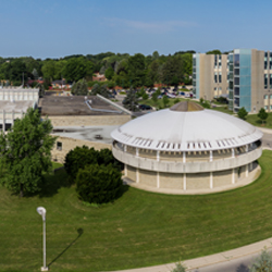 Photo of the side view of the domed library including the attached building.